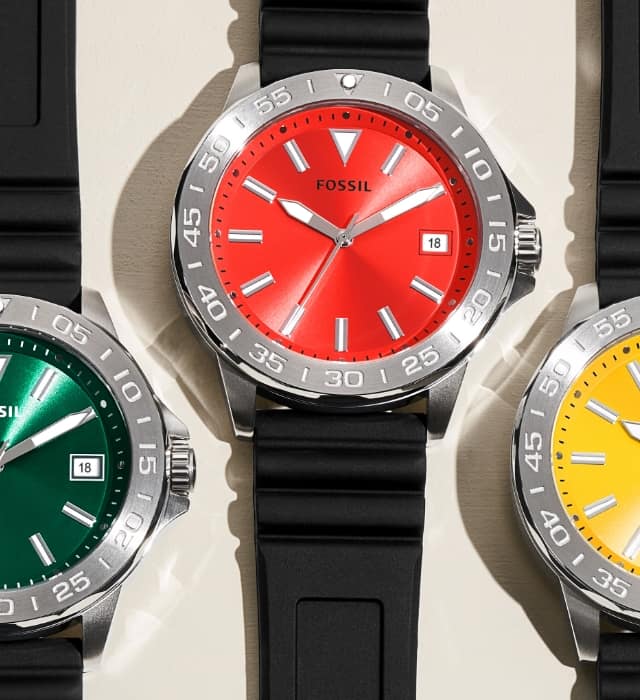 Men’s sporty watches with a black strap and colourful dials in orange, green, red, yellow and blue.