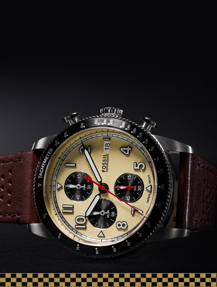 The brown leather Sport Tourer watch with checkered racing graphics below.