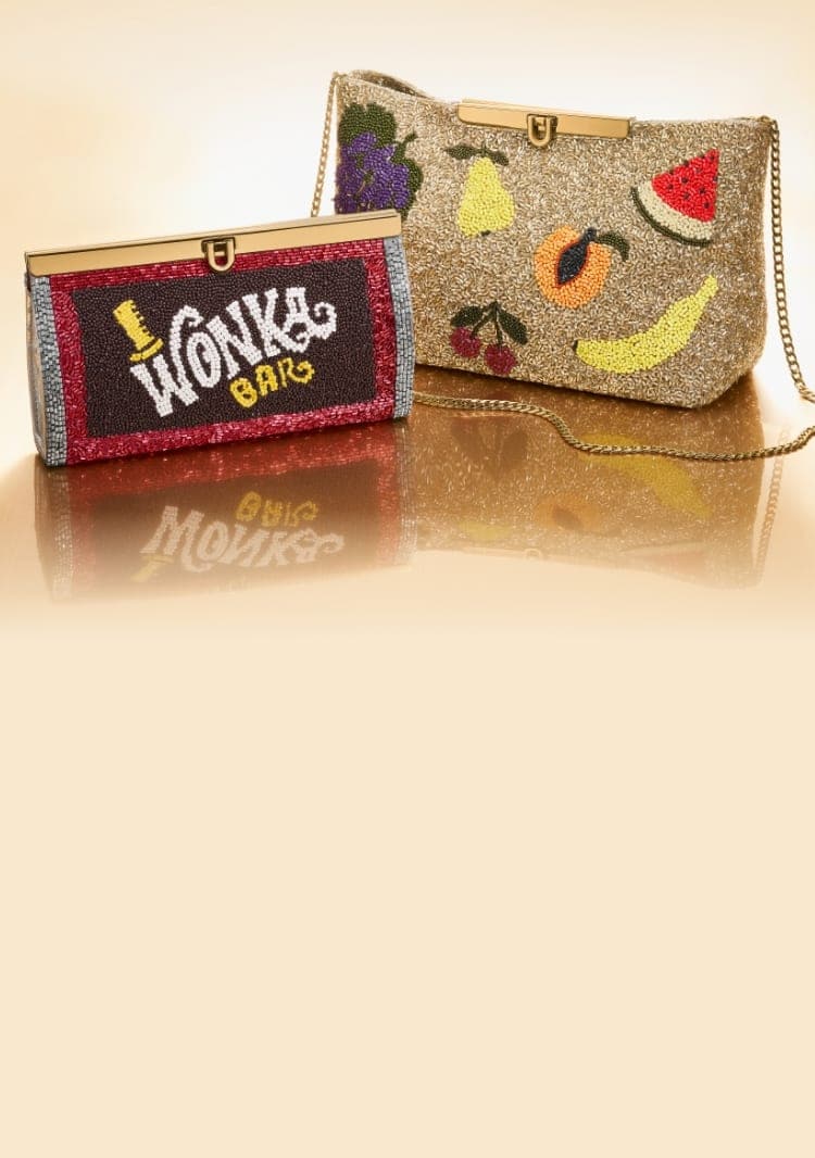 The hand-beaded clutch designed to look like a Wonka Bar and a hand-beaded clutch featuring fruit images.