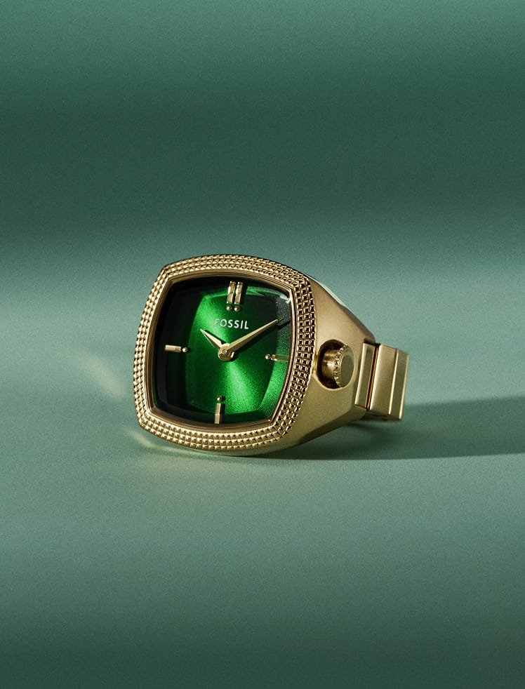 An image of Nick holding a bowling ball wearing the Machine Luxe watch ring on his pinkie finger.