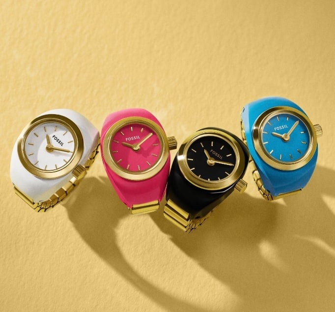 Four watch rings in turquoise blue, white, hot pink and black.