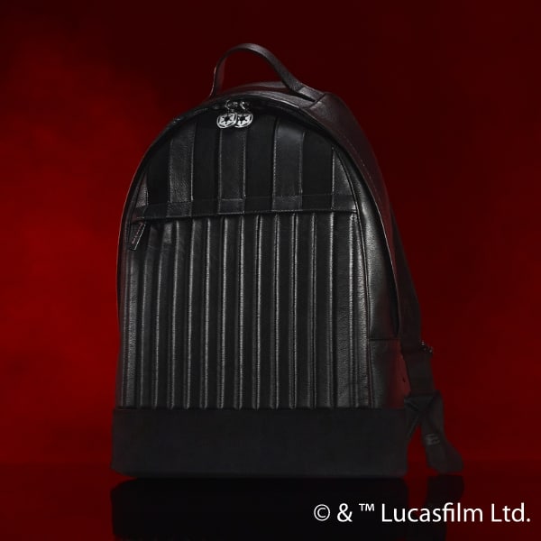 A black leather and suede Darth Vader-inspired backpack on a red smoky background.