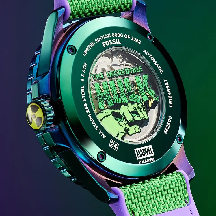 The display caseback of the watch reveals the automatic movement within, as well as an illustrated graphic of the Hulk fist and logo.