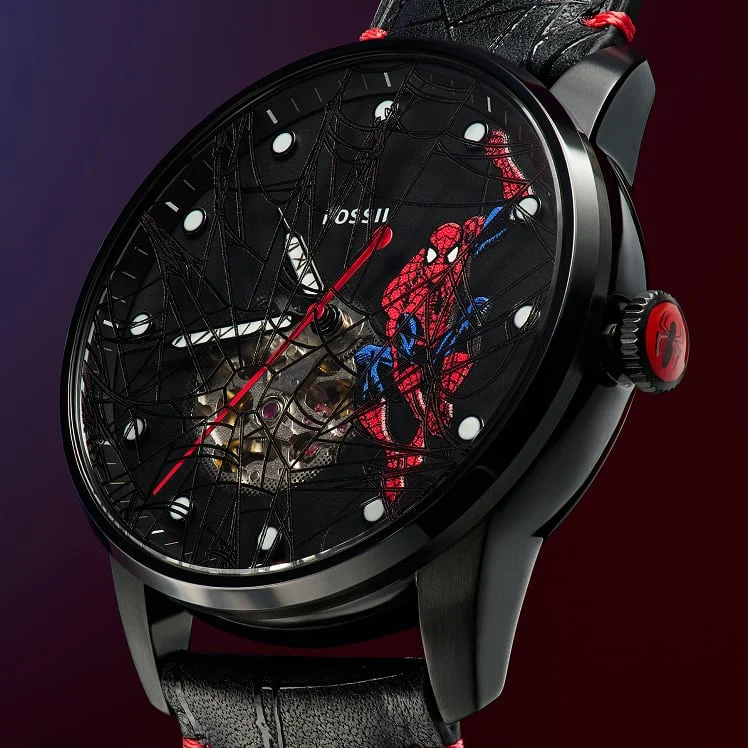 A detailed view of the black and red Fossil Spider-Man watch dial, featuring archival Marvel comic art.