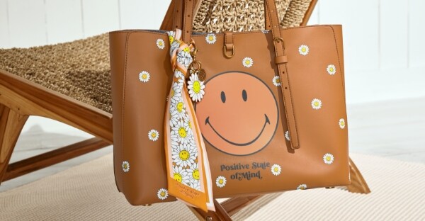 A brown vegan cactus Fossil x Smiley tote.