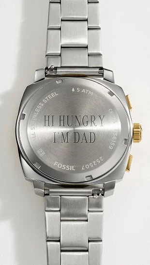 A Fossil watch caseback with a personalized engraving.