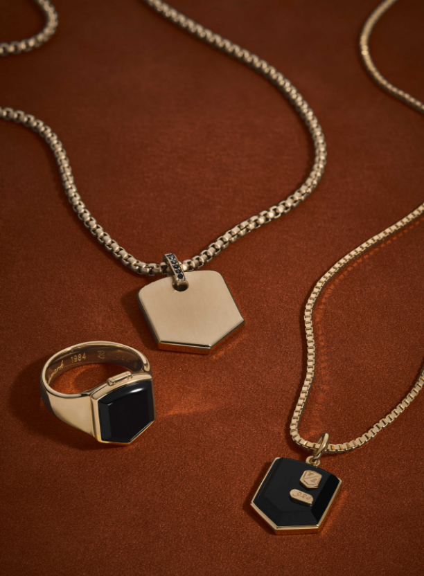 Men's gold and black jewelry.