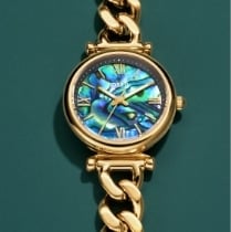 The gold-tone heart-shaped watch ring stacked on top of the silver-tone heart-shaped watch ring.