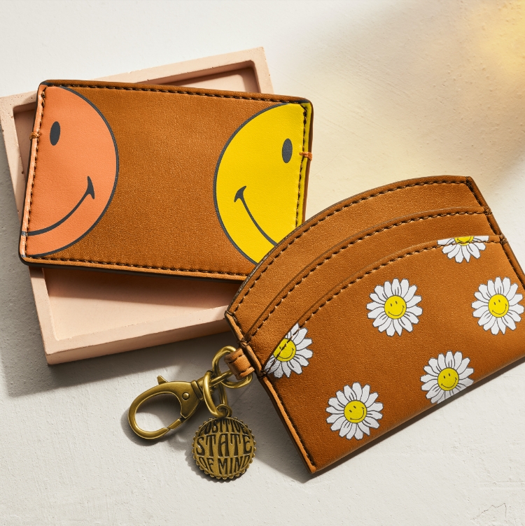 Daisy graphics. Two vegan cactus wallets with Smiley faces. Daisy graphics. Two vegan cactus wallets with Smiley faces.