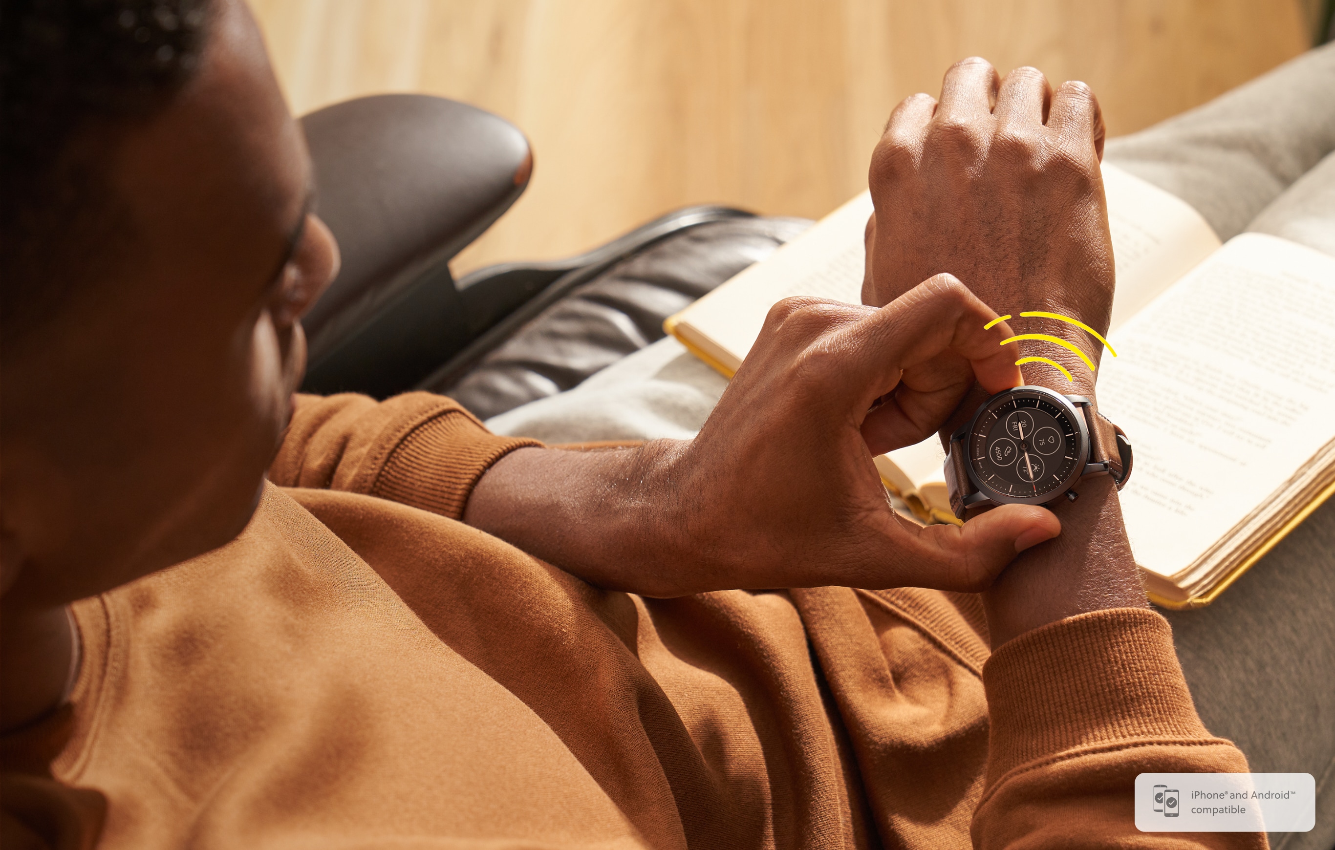 A man wearing a buzzing Hybrid Smartwatch HR.