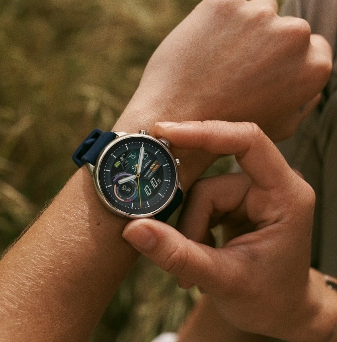 A person wearing a Gen 6 Wellness Edition smartwatch on their wrist.