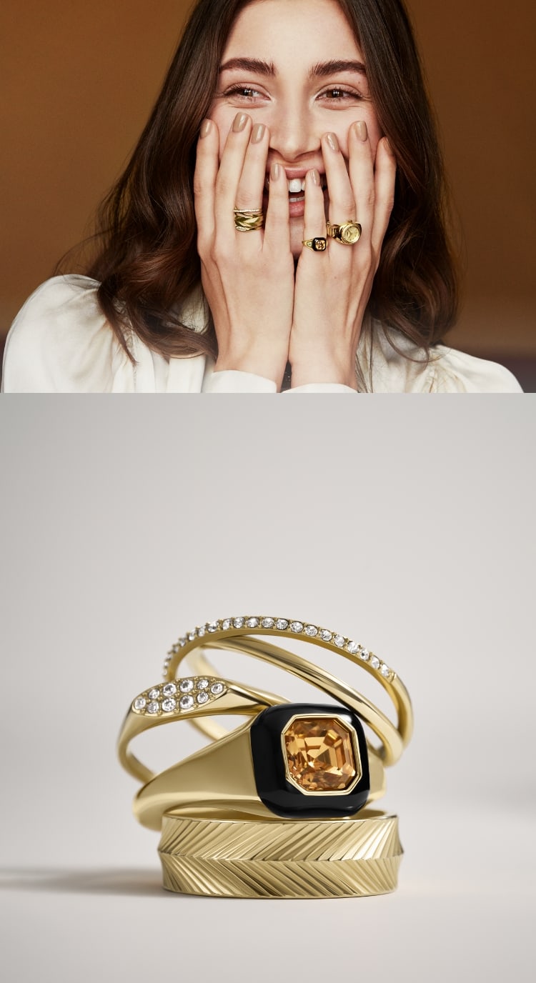 A stack of gold-tone rings. A woman smiling wearing various gold-tone rings from the fall collection.