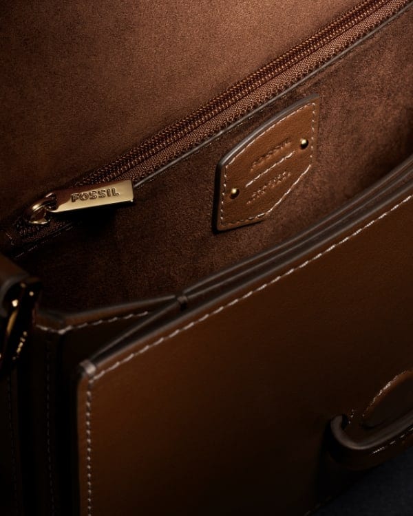 The interior lining of the brown leather Lennox bag.