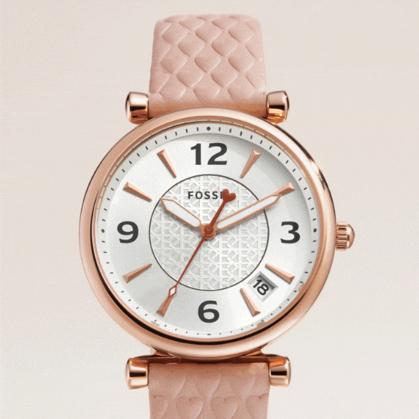 A woman’s Carlie watch with a blush strap.