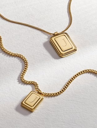 The Fossil Raquel engravable pendant necklace in a gold-tone finish. 