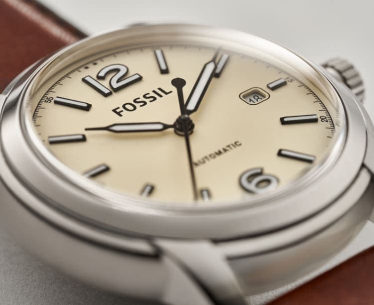 A closeup of a men's Fossil Heritage watch.