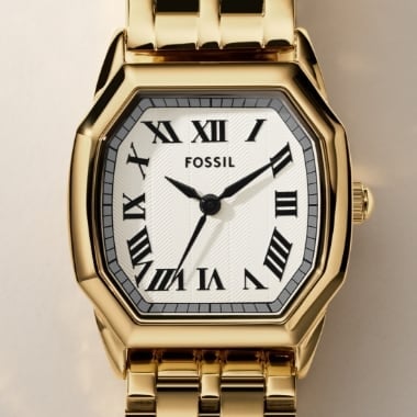 A gold-tone Harlow watch.