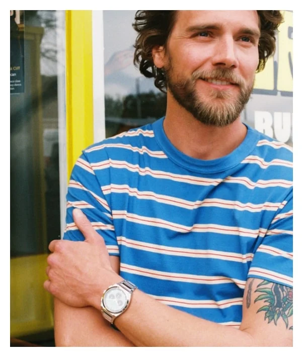 A man wearing a Fossil watch.