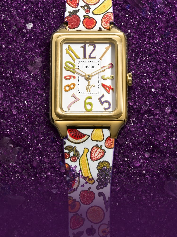 The limited edition Raquel watch, featuring a colourful dial and printed lickable wallpaper-inspired leather strap, atop purple sugar crystals. 