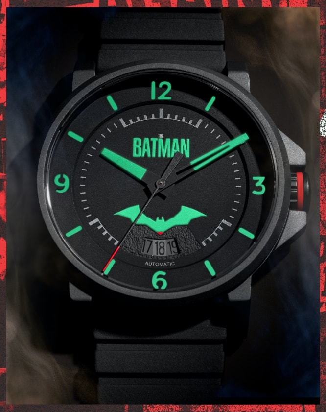 Black Batman x Fossil watch featuring animated smoke accents.