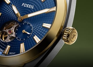 The sporty Everett watch, in a gold-tone finish with a green radial-textured dial.