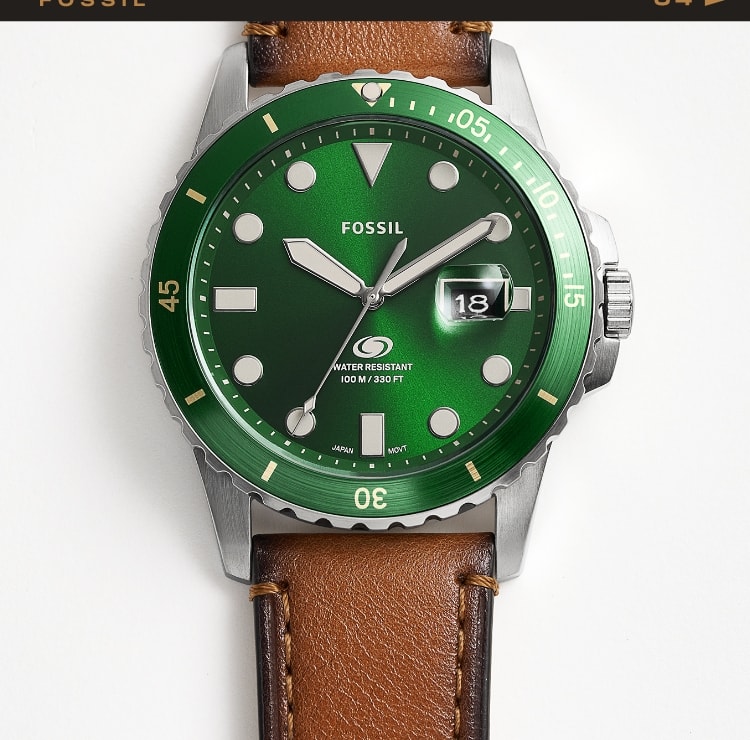 A brown leather Fossil Blue watch with a green dial.