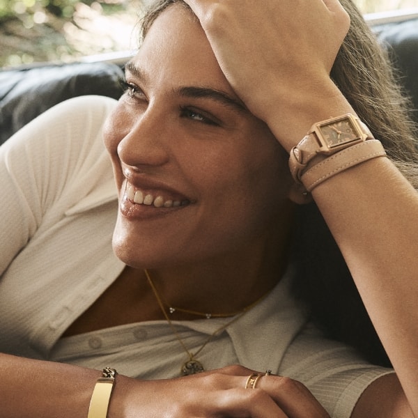Woman wearing a Raquel watch with double-wrap leather strap.