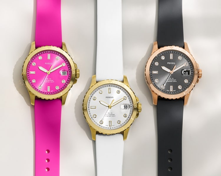 Three colorful FB-01 watched with silicone straps in hot pink, yellow and teal.