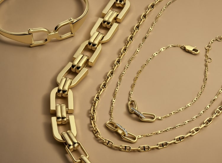 Gold-tone Fossil Heritage necklaces and bracelets.