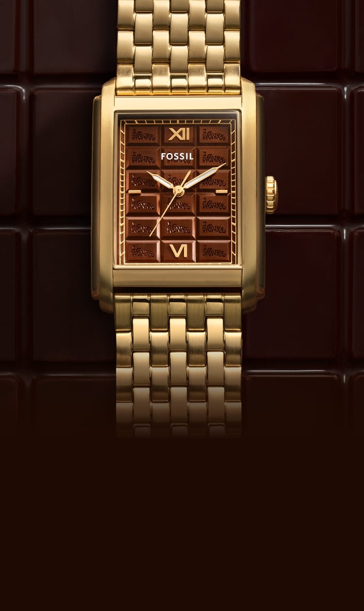 A brown chocolate bar-like background with a limited-edition gold-tone Carraway watch featuring a chocolate bar-inspired dial. 
