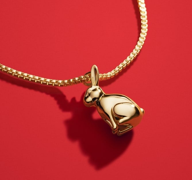 A 14k gold-plated sterling silver rabbit pendant necklace.