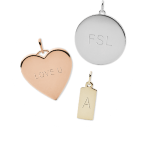 Three engraved charms.