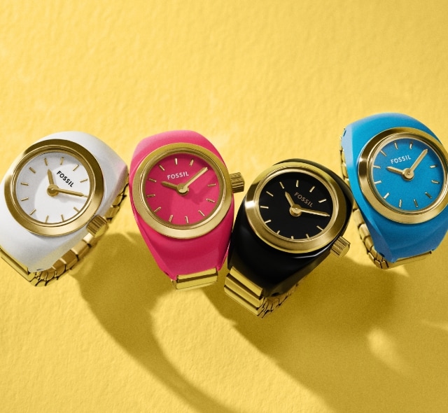 Four watch rings in turquoise blue, white, hot pink and black.