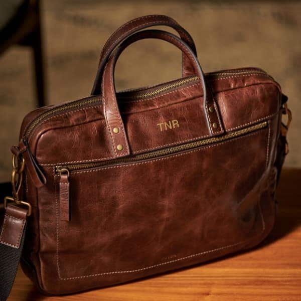 A brown leather Haskell workbag.