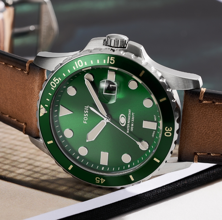 The brown leather Fossil Blue watch with a green dial. 