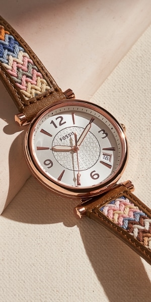 Woman’s watch with a zigzag patterned strap.