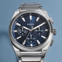 A silver-tone watch with blue dial.