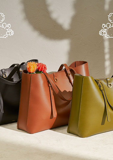 Three cactus leather Kier totes. Three cactus leather Kier totes.