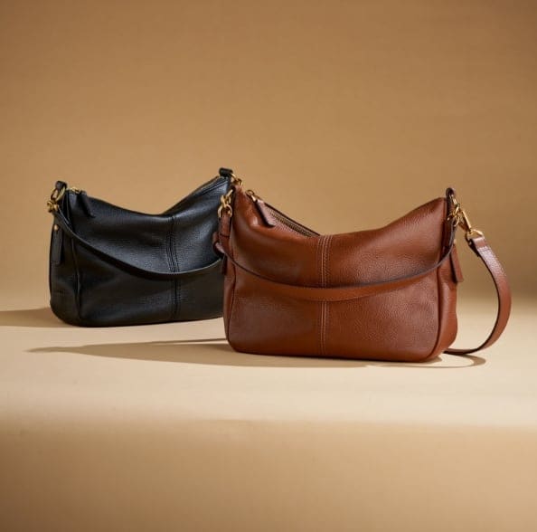 Black leather and a brown leather Jolie bags.