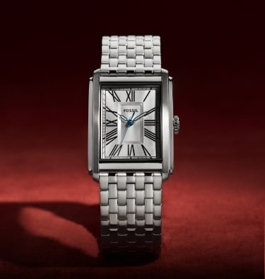 A silver-tone Carraway watch.