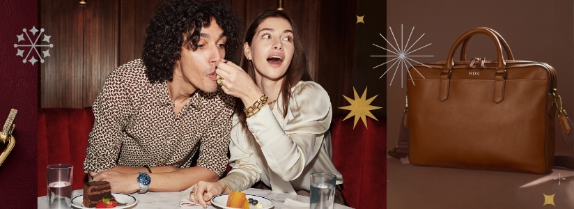 A woman feeding a man cake while wearing gold-tone jewelry. Star graphics.