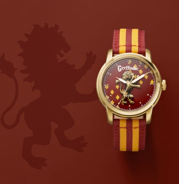Goldfarbene Gryffindor-Uhr mit rot-goldfarbenem Band.