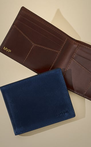Two men's wallets in navy blue and brown leather.
