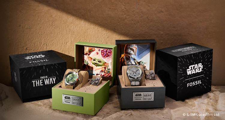 The Fossil limited-edition Mandalorian and Grogu watches, shown in their collectible display boxes