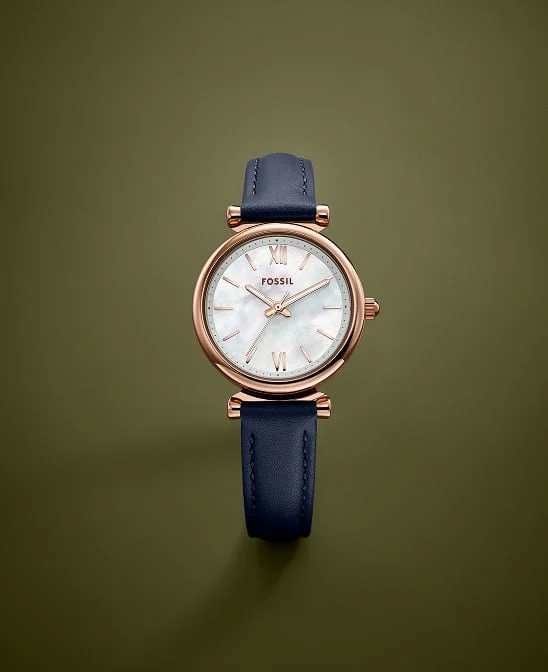 A women's Fossil watch featuring a mother-of-pearl dial and black leather strap.