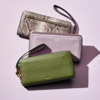 Three colorful women's wallets.