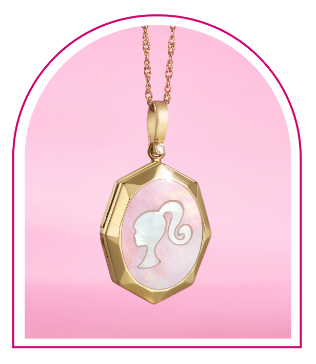 A pink background with a Barbie™ Mansion-inspired window. Inside the window hangs our limited edition Barbie™ x Fossil gold-tone locket featuring mother-of-pearl embellishments, a gold-tone stainless steel chain with a lobster clasp and finished with a stylish Barbie silhouette.