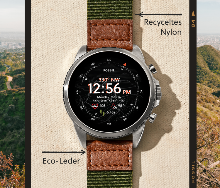 A Gen 6 Venture Edition smartwatch with green nylon strap and brown eco-leather accents. A Gen 6 Venture Edition smartwatch with green nylon strap and brown eco-leather accents.