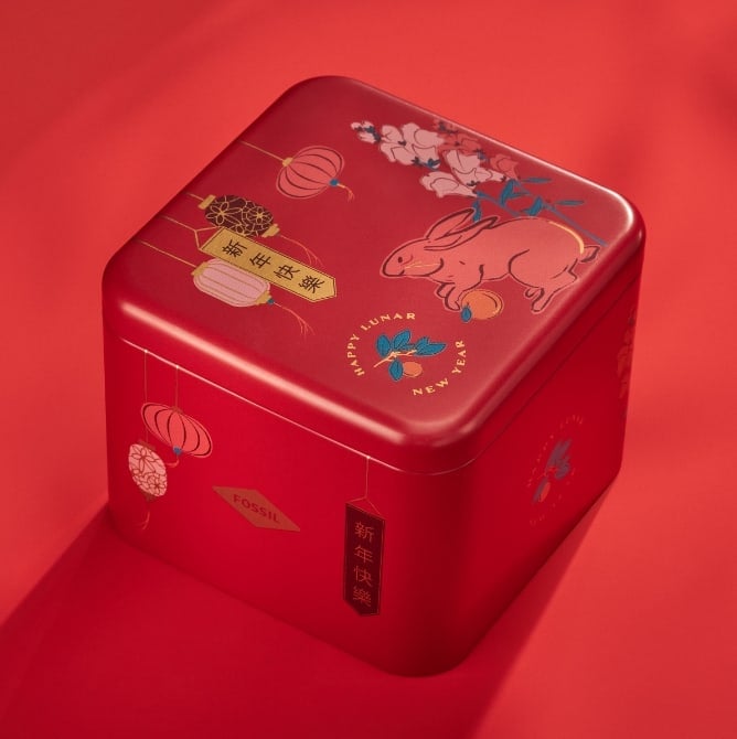 A red watch tin featuring rabbit graphics for Lunar New Year.