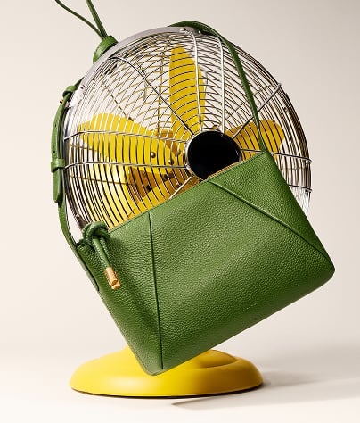 A green leather Fossil bag.